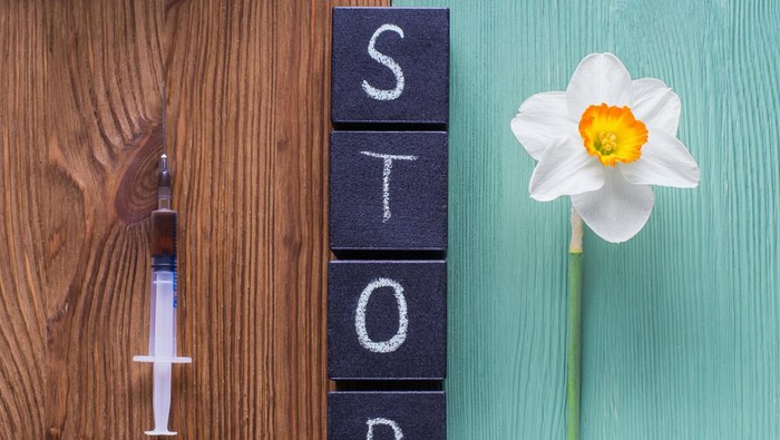 The concept of stop drug addiction. Choosing between drugs and a healthy lifestyle.