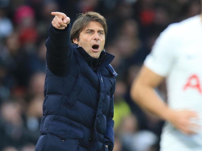 Tottenham Hotspur's Italian head coach Antonio Conte gestures on the touchline during the English Premier League football match between Manchester United and Tottenham Hotspur at Old Trafford in Manchester, north west England, on March 12, 2022. - RESTRICTED TO EDITORIAL USE. No use with unauthorized audio, video, data, fixture lists, club/league logos or 'live' services. Online in-match use limited to 120 images. An additional 40 images may be used in extra time. No video emulation. Social media in-match use limited to 120 images. An additional 40 images may be used in extra time. No use in betting publications, games or single club/league/player publications. (Photo by Lindsey Parnaby / AFP) / RESTRICTED TO EDITORIAL USE. No use with unauthorized audio, video, data, fixture lists, club/league logos or 'live' services. Online in-match use limited to 120 images. An additional 40 images may be used in extra time. No video emulation. Social media in-match use limited to 120 images. An additional 40 images may be used in extra time. No use in betting publications, games or single club/league/player publications. / RESTRICTED TO EDITORIAL USE. No use with unauthorized audio, video, data, fixture lists, club/league logos or 'live' services. Online in-match use limited to 120 images. An additional 40 images may be used in extra time. No video emulation. Social media in-match use limited to 120 images. An additional 40 images may be used in extra time. No use in betting publications, games or single club/league/player publications. (Photo by LINDSEY PARNABY/AFP via Getty Images)