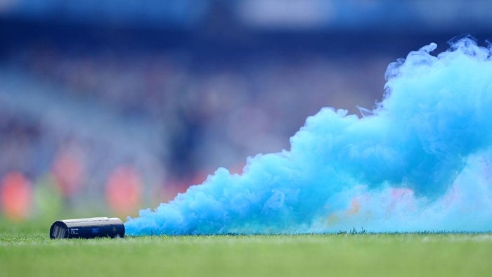 MANCHESTER, ENGLAND - MAY 22: A flare is seen on the pitch during the Premier League match between Manchester City and Aston Villa at Etihad Stadium on May 22, 2022 in Manchester, England. (Photo by Michael Regan/Getty Images)