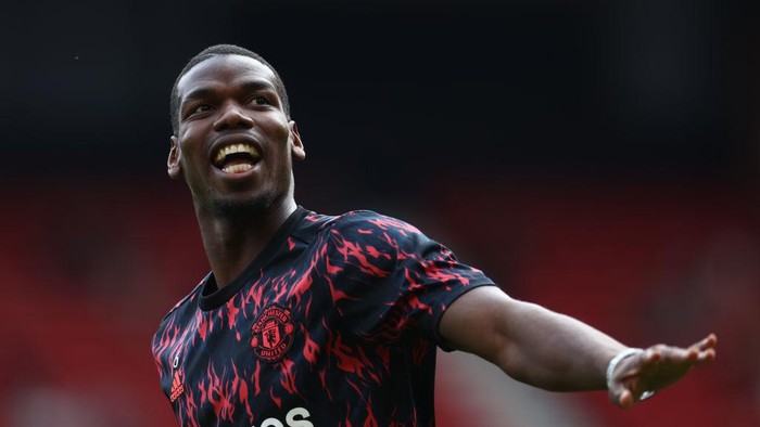 MANCHESTER, ENGLAND - APRIL 16: Paul Pogba of Manchester United warms up ahead of the Premier League match between Manchester United and Norwich City at Old Trafford on April 16, 2022 in Manchester, England. (Photo by Manchester United/Manchester United via Getty Images)