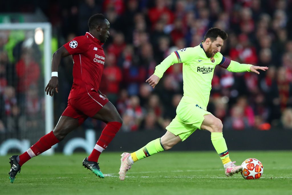 LIVERPOOL, ENGLAND - MAY 07:  Lionel Messi of Barcelona is chased by Sadio Mane of Liverpool during the UEFA Champions League Semi Final second leg match between Liverpool and Barcelona at Anfield on May 07, 2019 in Liverpool, England. (Photo by Clive Brunskill/Getty Images)