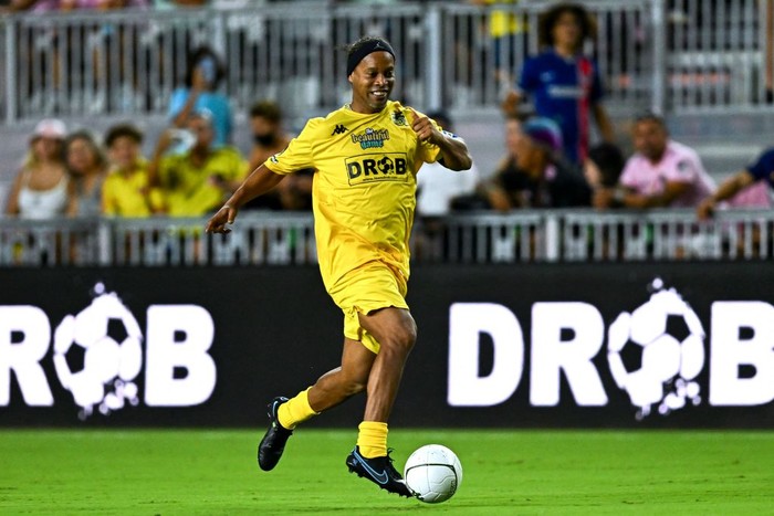 Brazilian football player Ronaldinho controls the ball during 