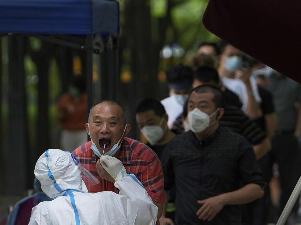 China Kurangi Masa Karantina untuk Pendatang dari Luar Negeri China Kurangi Masa Karantina untuk Pendatang dari Luar Negeri