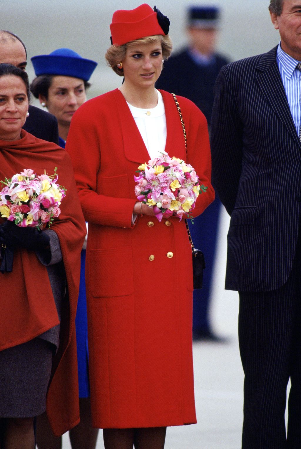 LONDON, UNITED KINGDOM - FEBRUARY 26:  Diana, Princess Of Wales Carrying A Bouquet Of Flowers At Great Ormond Street Hospital For Children.  Jacket Reported To Be By Fashion Designer Chanel.  (Photo by Tim Graham Photo Library via Getty Images)