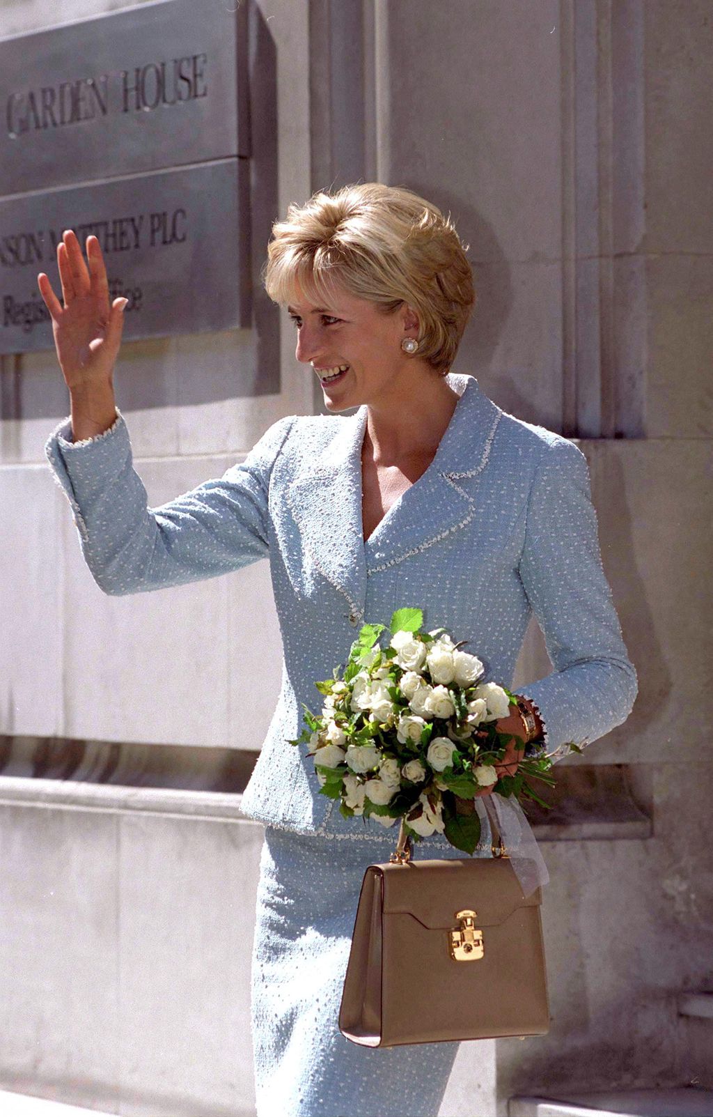 LONDON, UNITED KINGDOM - APRIL 21:  Diana, Princess Of Wales, Leaving The British Lung Foundation In Hatton Garden After Being  Presented With A Bouquet Of The First Rose Named After Her. Diana's Suit Is Designed By Fashion Designer Chanel And She Is Carrying A Handbag Designed By Fashion Designer Lana Marks.  (Photo by Tim Graham Photo Library via Getty Images)