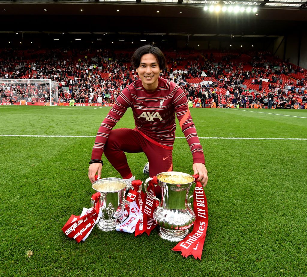 LONDON, ENGLAND - MAY 14: Liverpool's Takumi Minamino celebrates winning the FA Cup after a penalty shoot-out during The FA Cup Final match between Chelsea and Liverpool at Wembley Stadium on May 14, 2022 in London, England. (Photo by Andrew Kearns - CameraSport via Getty Images)