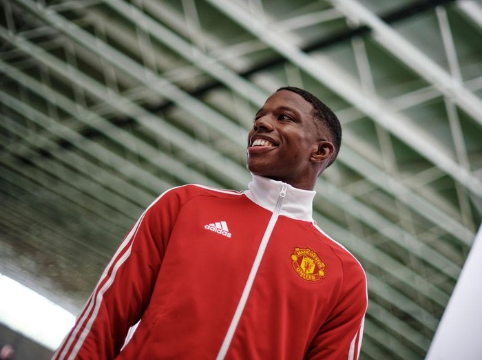 MANCHESTER, ENGLAND - JULY 05: (EXCLUSIVE COVERAGE) Tyrell Malacia of Manchester United poses after signing his contract with the club at Carrington Training Ground on July 05, 2022 in Manchester, England. (Photo by Ash Donelon/Manchester United via Getty Images)