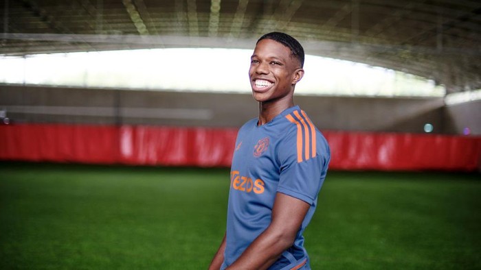 MANCHESTER, ENGLAND - JULY 05: (EXCLUSIVE COVERAGE) Tyrell Malacia of Manchester United poses after signing his contract with the club at Carrington Training Ground on July 05, 2022 in Manchester, England. (Photo by Ash Donelon/Manchester United via Getty Images)