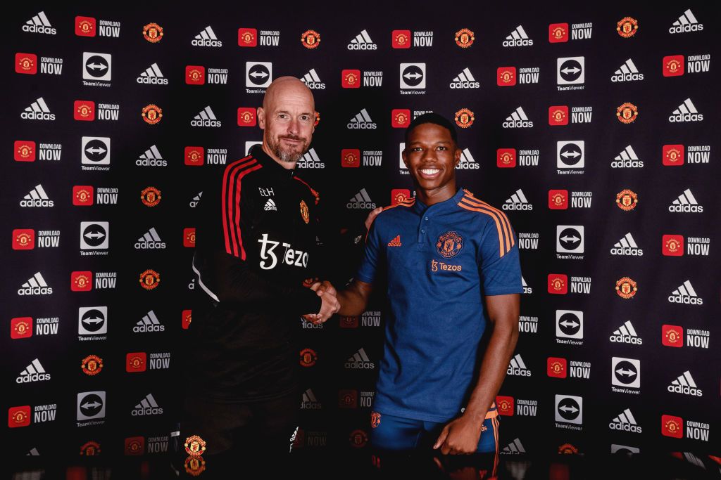 MANCHESTER, ENGLAND - JULY 05: (EXCLUSIVE COVERAGE) Tyrell Malacia of Manchester United poses with Manager Erik ten Hag after signing his contract with the club at Carrington Training Ground on July 05, 2022 in Manchester, England. (Photo by Ash Donelon/Manchester United via Getty Images)