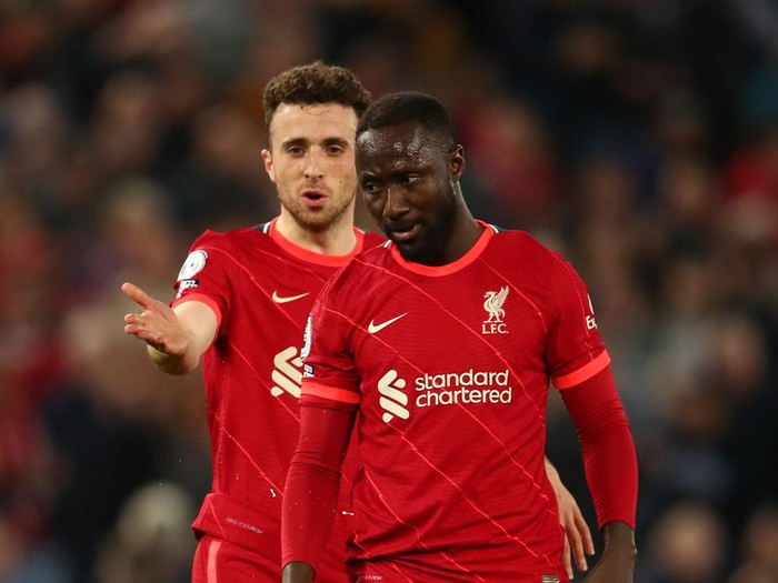 LIVERPOOL, ENGLAND - MAY 07: Naby Keita of Liverpool reacts as team-mate Diogo Jota makes a point during the Premier League match between Liverpool and Tottenham Hotspur at Anfield on May 07, 2022 in Liverpool, England. (Photo by Chris Brunskill/Fantasista/Getty Images)