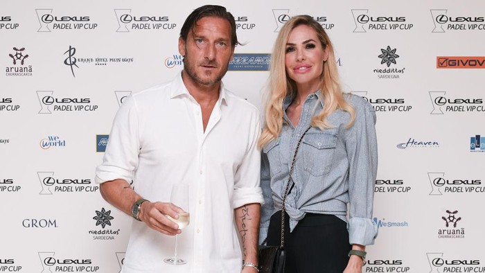 POLTU QUATU, ITALY - JULY 10: Former Italian football player Francesco Totti and his wife Italian showgirl Ilary Blasi pose for a picture at the backdrop before the dinner gala of 