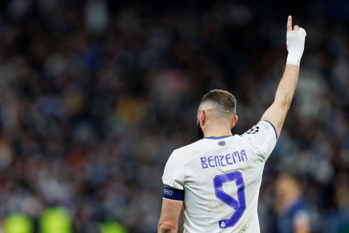 Karim Benzema MADRID, SPAIN - MARCH 09: Karim Benzema of Real Madrid CF celebrates after scoring his team's second goal during the UEFA Champions League Round Of Sixteen Leg Two match between Real Madrid and Paris Saint-Germain at Estadio Santiago Bernabeu on March 9, 2022 in Madrid, Spain. (Photo by Berengui/DeFodi Images via Getty Images)