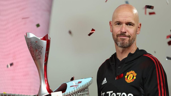 BANGKOK, THAILAND - JULY 12: Erik Ten Hag the manager / head coach of Manchester United holding the winners The Match Bangkok Century Cup 2022 trophy during the preseason friendly match between Liverpool and Manchester United at Rajamangala Stadium on July 12, 2022 in Bangkok, Thailand. (Photo by Matthew Ashton - AMA/Getty Images)