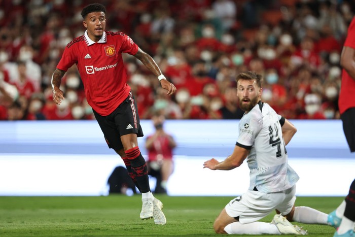 MU vs Liverpool, Jadon Sancho BANGKOK, THAILAND - JULY 12: Jadon Sancho of Manchester United scores a goal to make it 1-0 during the preseason friendly match between Liverpool and Manchester United at Rajamangala Stadium on July 12, 2022 in Bangkok, Thailand. (Photo by Matthew Ashton - AMA/Getty Images)