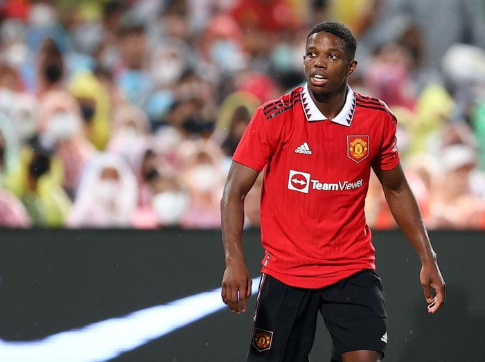 BANGKOK, THAILAND - JULY 12: Tyrell Malacia #12 of Manchester United looks on during the second half of a preseason friendly match against Liverpool at Rajamangala National Stadium on July 12, 2022 in Bangkok, Thailand. (Photo by Pakawich Damrongkiattisak/Getty Images)