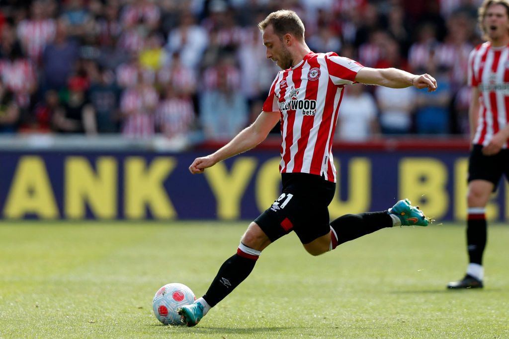 Brentford's Danish midfielder Christian Eriksen crosses the ball during the English Premier League football match between Brentford and Leeds United at Brentford Community Stadium in London on May 22, 2022. - - RESTRICTED TO EDITORIAL USE. No use with unauthorized audio, video, data, fixture lists, club/league logos or 'live' services. Online in-match use limited to 120 images. An additional 40 images may be used in extra time. No video emulation. Social media in-match use limited to 120 images. An additional 40 images may be used in extra time. No use in betting publications, games or single club/league/player publications. (Photo by Adrian DENNIS / AFP) / RESTRICTED TO EDITORIAL USE. No use with unauthorized audio, video, data, fixture lists, club/league logos or 'live' services. Online in-match use limited to 120 images. An additional 40 images may be used in extra time. No video emulation. Social media in-match use limited to 120 images. An additional 40 images may be used in extra time. No use in betting publications, games or single club/league/player publications. / RESTRICTED TO EDITORIAL USE. No use with unauthorized audio, video, data, fixture lists, club/league logos or 'live' services. Online in-match use limited to 120 images. An additional 40 images may be used in extra time. No video emulation. Social media in-match use limited to 120 images. An additional 40 images may be used in extra time. No use in betting publications, games or single club/league/player publications. (Photo by ADRIAN DENNIS/AFP via Getty Images)