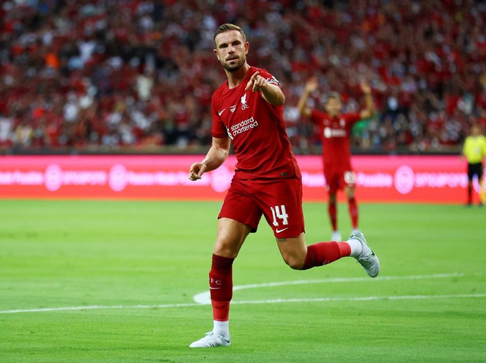 SINGAPORE, SINGAPORE - JULY 15: Jordan Henderson #14 of Liverpool celebrates after scoring his teams first goal against Crystal Palace during the first half of their preseason friendly at the National Stadium on July 15, 2022 in Singapore. (Photo by Yong Teck Lim/Getty Images)