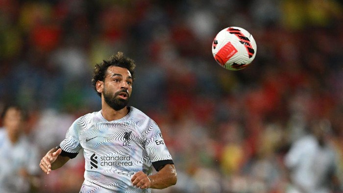 Mohamed Salah Liverpool's Egyptian forward Mohamed Salah looks towards the ball during the exhibition football match between English Premier League teams Manchester United and Liverpool FC at Rajamangala National Stadium in Bangkok on July 12, 2022. (Photo by MANAN VATSYAYANA / AFP) (Photo by MANAN VATSYAYANA/AFP via Getty Images)
