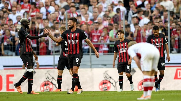COLOGNE, GERMANY - JULY 16: Oliver Giroud of AC Milan celebrates after scoring his team´s second goal during the FC Koeln v AC Milan game at RheinEnergieStadion on July 16, 2022 in Cologne, Germany. (Photo by Frederic Scheidemann/Getty Images)