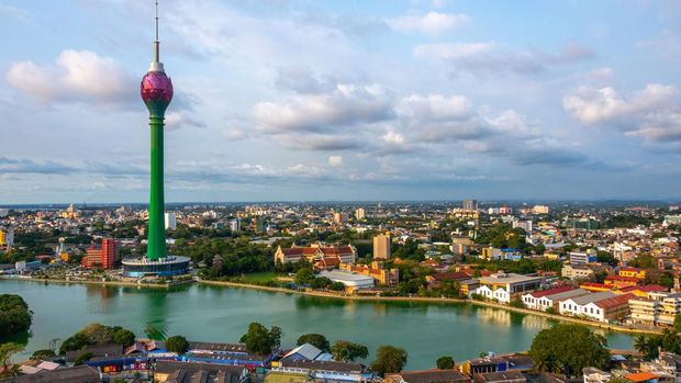 Lotus Tower and buildings along a lake in downtown Colombo Sri Lanka