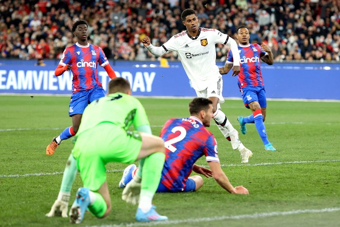 Manchester Uniteds Marcus Rashford (C) scores a against Crystal Palace during the pre-season football match between English Premier League teams Manchester United and Crystal Palace at the Melbourne Cricket Ground (MCG) on July 19, 2022, in Melbourne. - -- IMAGE RESTRICTED TO EDITORIAL USE - STRICTLY NO COMMERCIAL USE -- (Photo by Martin KEEP / AFP) / -- IMAGE RESTRICTED TO EDITORIAL USE - STRICTLY NO COMMERCIAL USE -- (Photo by MARTIN KEEP/AFP via Getty Images)