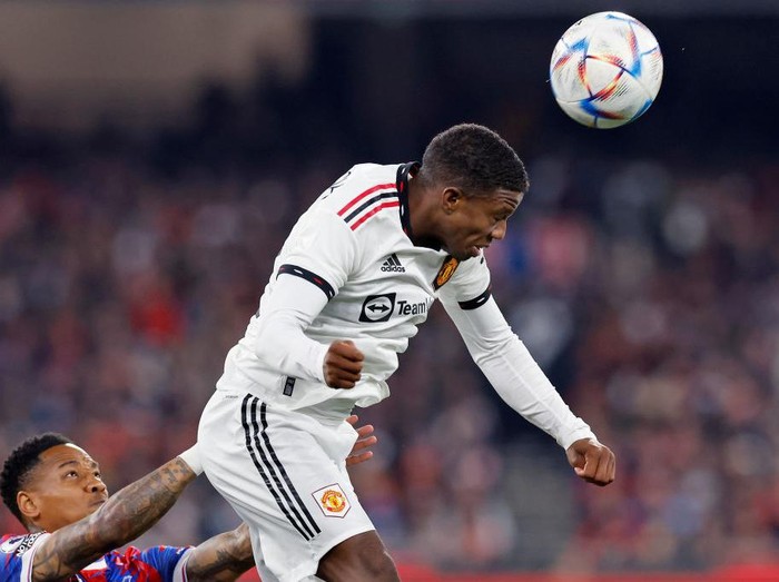 MELBOURNE, AUSTRALIA - JULY 19: Tyrell Malacia of Manchester United heads the ball during the Pre-Season Friendly match between Manchester United and Crystal Palace at Melbourne Cricket Ground on July 19, 2022 in Melbourne, Australia. (Photo by Mark Evans/Getty Images)