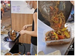 Tampil Beda, Pedagang Makanan Ini Masak dengan Wajan Penyok