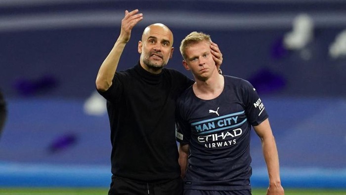 Manchester City manager Pep Guardiola consoles Oleksandr Zinchenko following the UEFA Champions League semi final, second leg match at the Santiago Bernabeu, Madrid. Picture date: Wednesday May 4, 2022. (Photo by Nick Potts/PA Images via Getty Images)