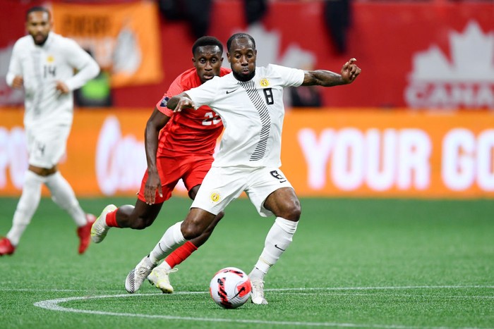 VANCOUVER, CANADA - JUNE 9: Richie Laryea of Canada, Vurnon Anita of Curacao  during the  International Friendly match between Canada  v Curacao at the BC Place Stadium on June 9, 2022 in Vancouver Canada (Photo by Dale MacMillan/Soccrates/Getty Images)