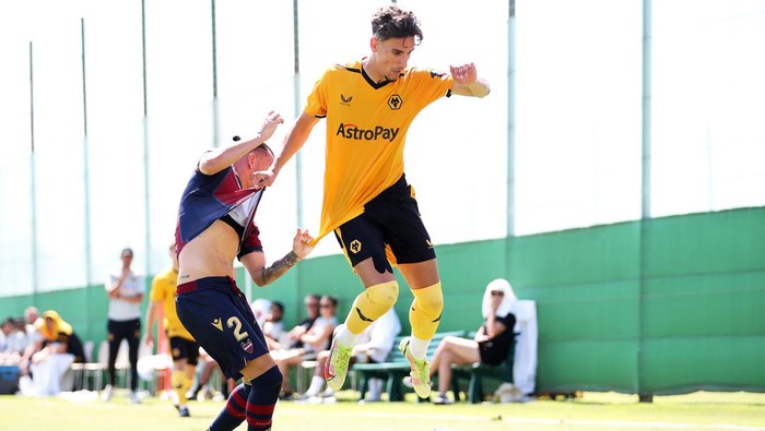 ALICANTE, SPAIN - JULY 21: Theo Corbeanu of Wolverhampton Wanderers is challenged by Francisco Javier Hidalgo Gomez
of Levante during the Behind Closed Doors Pre-Season Friendly between Levante and Wolverhampton Wanderers on July 21, 2022 in Alicante, Spain. (Photo by Jack Thomas - WWFC/Wolves via Getty Images)