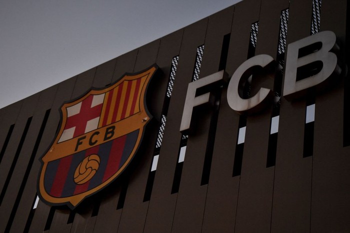 This photograph taken on August 5, 2021 shows the logo of FC Barcelona on the facade of the Camp Nou stadium in Barcelona. - Lionel Messi will end his 20-year career with Barcelona after the Argentine superstar failed to reach agreement on a new deal with the club, the Spanish giants announced on August 5, 2021. (Photo by Pau BARRENA / AFP) (Photo by PAU BARRENA/AFP via Getty Images)