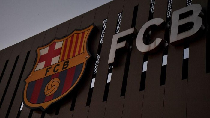 This photograph taken on August 5, 2021 shows the logo of FC Barcelona on the facade of the Camp Nou stadium in Barcelona. - Lionel Messi will end his 20-year career with Barcelona after the Argentine superstar failed to reach agreement on a new deal with the club, the Spanish giants announced on August 5, 2021. (Photo by Pau BARRENA / AFP) (Photo by PAU BARRENA/AFP via Getty Images)