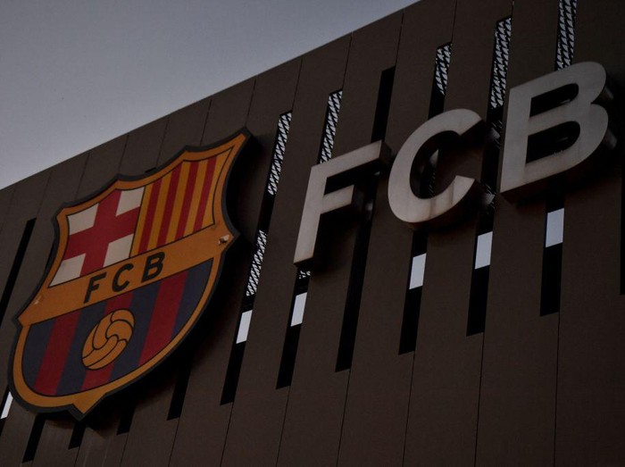This photograph taken on August 5, 2021 shows the logo of FC Barcelona on the facade of the Camp Nou stadium in Barcelona. - Lionel Messi will end his 20-year career with Barcelona after the Argentine superstar failed to reach agreement on a new deal with the club, the Spanish giants announced on August 5, 2021. (Photo by Pau BARRENA / AFP) (Photo by PAU BARRENA/AFP via Getty Images)