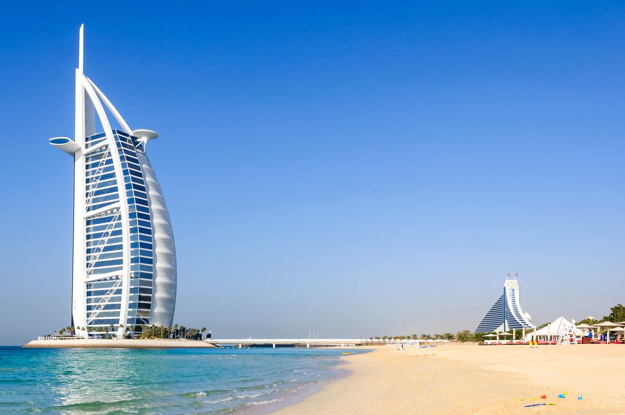 Dubai, United Arab Emirates - January 08, 2012: View of Burj Al Arab hotel from the Jumeirah beach. Burj Al Arab is one of the Dubai landmark, and one of the world's most luxurious hotels with 7 stars.