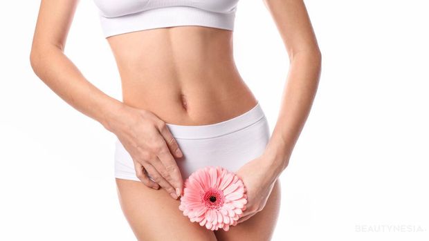 Beautiful woman with flower isolated on white background, concept menstruation