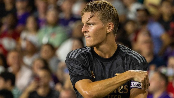 ORLANDO, FL - JULY 20: Martin Ødegaard (8) of Arsenal adjusts his captains armband during a game between Arsenal FC and Orlando City at Exploria Stadium on July 20, 2022 in Orlando, Florida. (Photo by Trevor Ruszkowski/ISI Photos/Getty Images)