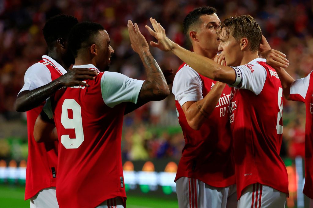 ORLANDO, FLORIDA - JULY 23: Martin Odegaard of Arsenal celebrates with teammates Gabriel Jesus and Granit Xhaka after scoring their side's second goal  during the Florida Cup match between Chelsea and Arsenal at Camping World Stadium on July 23, 2022 in Orlando, Florida. (Photo by Mike Ehrmann/Getty Images)