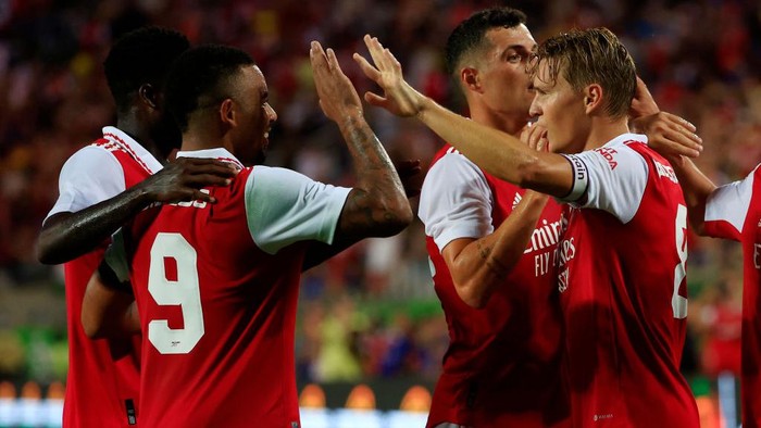 ORLANDO, FLORIDA - JULY 23: Martin Odegaard of Arsenal celebrates with teammates Gabriel Jesus and Granit Xhaka after scoring their sides second goal  during the Florida Cup match between Chelsea and Arsenal at Camping World Stadium on July 23, 2022 in Orlando, Florida. (Photo by Mike Ehrmann/Getty Images)