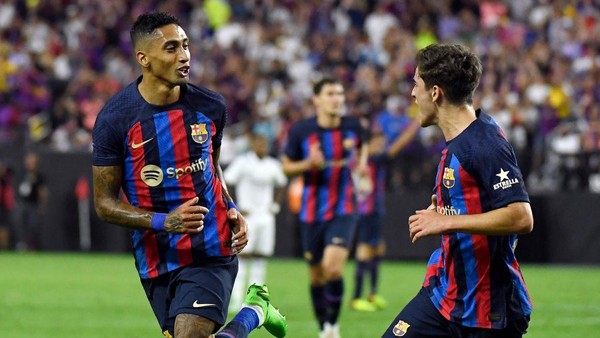 Barcelona LAS VEGAS, NV - JULY 23: Raphinha #22 of Barcelona celebrates with Pablo Paez Gavira #30 after scoring his first goal during the first half against Real Madrid during the preseason friendly match at Allegiant Stadium on July 23, 2022 in Las Vegas, Nevada. (Photo by Kevork Djansezian/Getty Images)