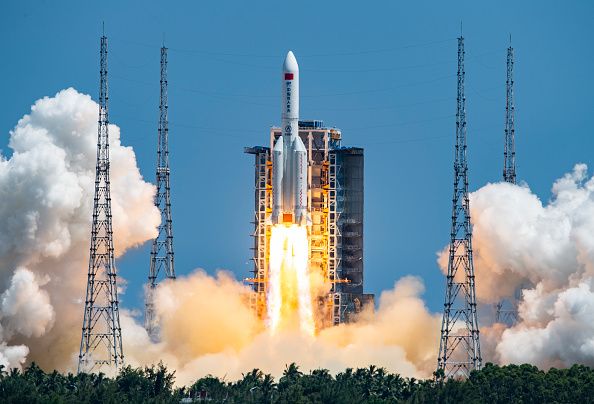 WENCHANG, CHINA - JULY 24: Spectators watch as a Long March-5B Y3 rocket carrying China's space station lab module Wentian blasts off from Wenchang Spacecraft Launch Site on July 24, 2022 in Wenchang, Hainan Province of China. (Photo by Luo Yunfei/China News Service via Getty Images)