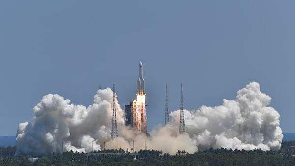 WENCHANG, CHINA - JULY 24: Spectators watch as a Long March-5B Y3 rocket carrying Chinas space station lab module Wentian blasts off from Wenchang Spacecraft Launch Site on July 24, 2022 in Wenchang, Hainan Province of China. (Photo by Luo Yunfei/China News Service via Getty Images)