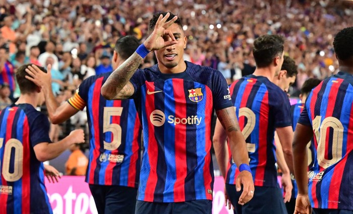 Barcelona's Raphinha gestures after scoring a goal during the international friendly football match between Barcelona and Real Madrid at Allegiant Stadium in Las Vegas, Nevada, on July 23, 2022. (Photo by Frederic J. BROWN / AFP) (Photo by FREDERIC J. BROWN/AFP via Getty Images)