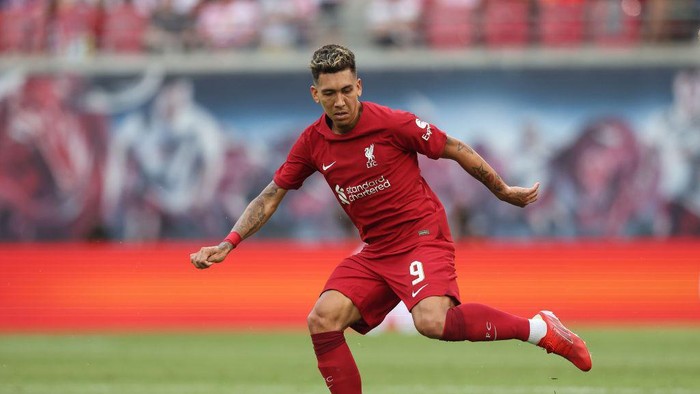 LEIPZIG, GERMANY - JULY 21: Roberto Firmino of Liverpool runs with the ball during the pre-season friendly match between RB Leipzig and Liverpool FC at Red Bull Arena on July 21, 2022 in Leipzig, Germany. (Photo by Alexander Hassenstein/Getty Images)