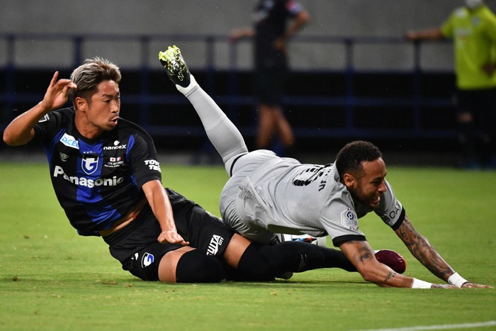 Neymar, Gamba Osaka Paris Saint-Germain's Brazilian forward Neymar (R) falls in a tackle from Gamba Osaka's Japanese midfielder Genta Miura during PSG's Japan Tour football match against Gamba Osaka at Suita stadium in Osaka on July 25, 2022. (Photo by Kazuhiro NOGI / AFP) (Photo by KAZUHIRO NOGI/AFP via Getty Images)