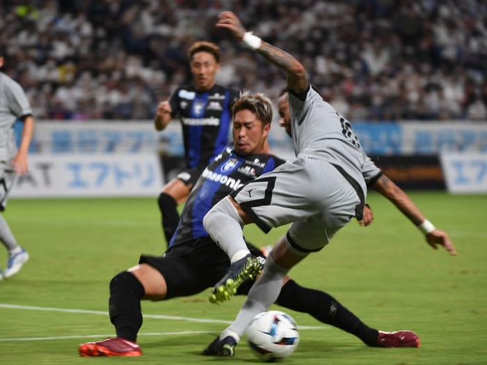 SUITA, JAPAN - JULY 25: Neymar Jr of Paris Saint- Germain fouled by Shota Fukuoka of Gamba Osaka in the box and gets penalty kick during the preseason friendly between Paris Saint-Germain and Gamba Osaka at Panasonic Stadium Suita on July 25, 2022 in Suita, Osaka, Japan.  (Photo by Kaz Photography/Getty Images)