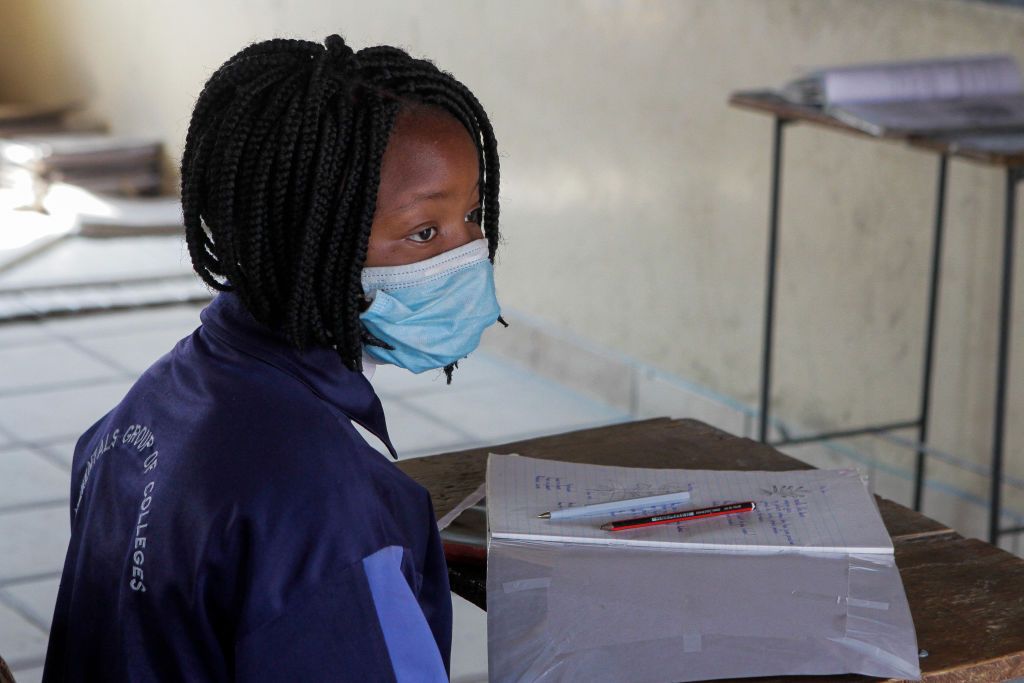 HARARE, ZIMBABWE - SEPTEMBER 30: A Grade 7 level pupil during an in-class session two days after the school's resumption on September 30, 2020 in Harare, Zimbabwe. The country's schools partly reopened this week for students in two grades, as part of a phased return that should see all pupils welcomed back in November. However many teachers are not returning to work, demanding a pay raise. Schools were shut in March in a bid to curb the spread of Covid-19. (Photo by Tafadzwa Ufumeli/Getty Images)