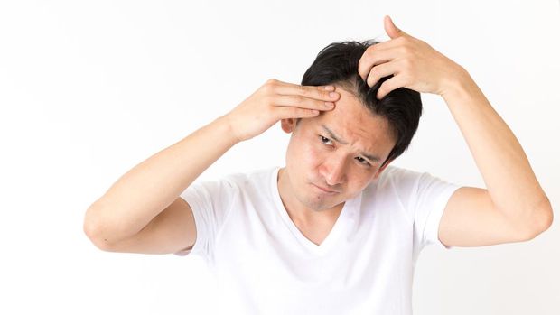 portrait of young asian man isolated on white background