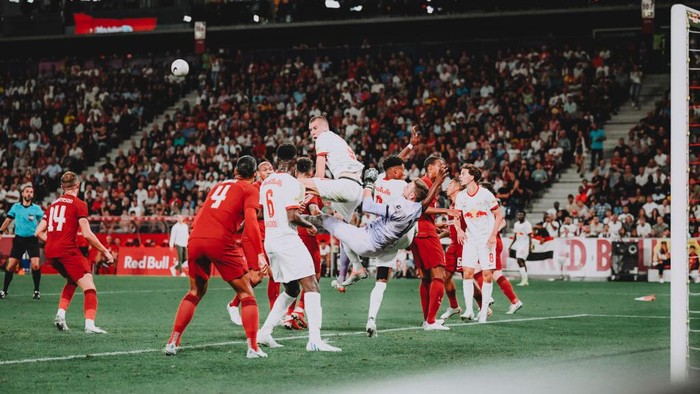 SALZBURG, AUSTRIA - JULY 27: Strahinja Pavlovic (top) of Salzburg fights for the ball with goalkeeper Adrian of Liverpool during the friendly match between FC Red Bull Salzburg and Liverpool FC at Red Bull Arena on July 27, 2022 in Salzburg, Austria. (Photo by Andreas Schaad - FC Red Bull Salzburg/FC Red Bull Salzburg via Getty Images)