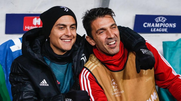 Paulo Dybala (L) and Gianluigi Buffon of Juventus share a laughter during the UEFA Champions League Group D match between Lokomotiv Moskva and Juventus FC on November 6, 2019 at RZD Arena in Moscow, Russia. (Photo by Mike Kireev/NurPhoto via Getty Images)