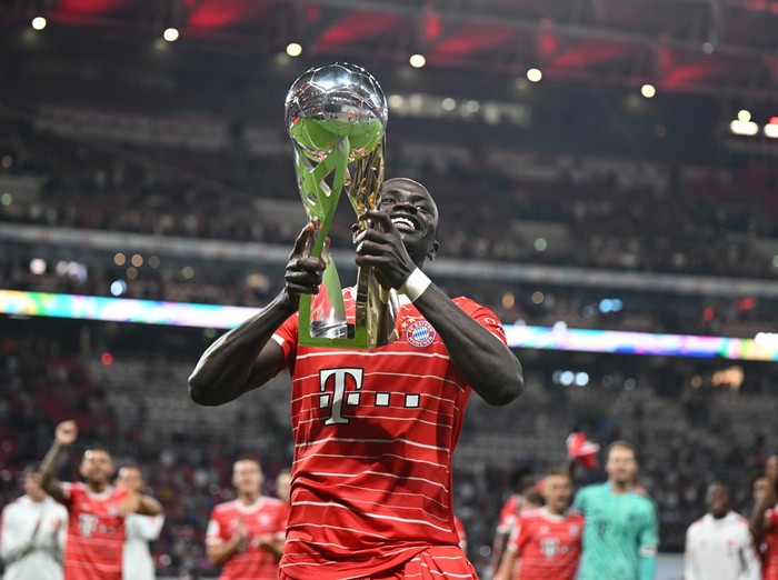 LEIPZIG, GERMANY - JULY 30: Sadio Mane of Bayern lifts the trophy after the Supercup 2022 match between RB Leipzig and FC Bayern München at Red Bull Arena on July 30, 2022 in Leipzig, Germany. (Photo by Marvin Ibo Guengoer - GES Sportfoto/Getty Images)